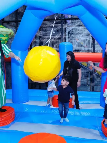 Even parents can't resist the fun! A group of moms and kids play together in one of our large inflatable arenas.