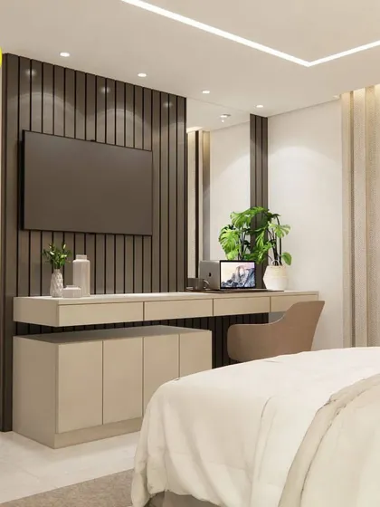 A view of the TV and study unit from the bed, showing how it integrates perfectly into the room's overall design.