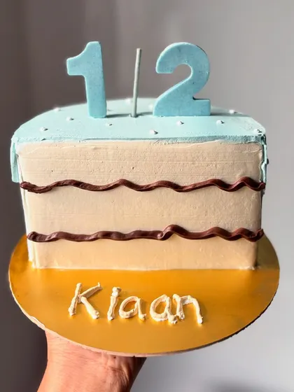 Celebrating a half birthday with this cute half-cake design. It's a fun and unique way to mark the six-month milestone for a little one.