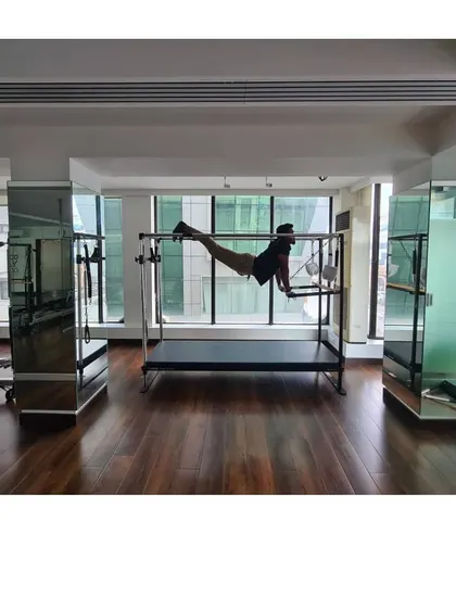 Looking forward to the future. This horizontal hold on the Cadillac is a full-body challenge, demanding core strength and endurance.