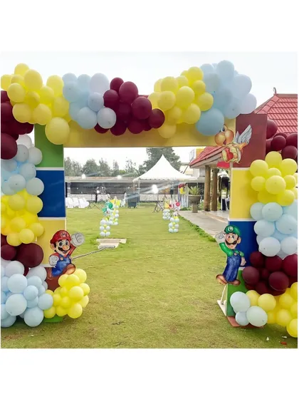 A grand balloon arch entrance for a Super Mario party. Mario and Luigi stand guard, welcoming guests to a world of gaming adventure.