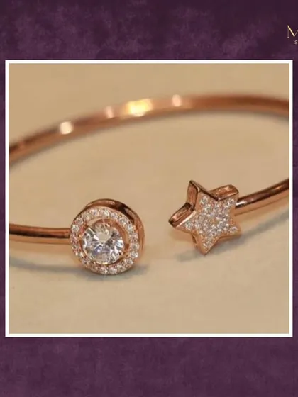 A touch of celestial charm. This delicate open cuff bracelet in rose gold features a sparkling star on one end and a round solitaire on the other. It's a perfect balance of sophistication and whimsy.