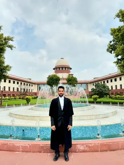 Standing before the Supreme Court of India, where I represent clients and file crucial legal documents. This institution represents the pinnacle of justice in our country, and it is an honor to practice here.