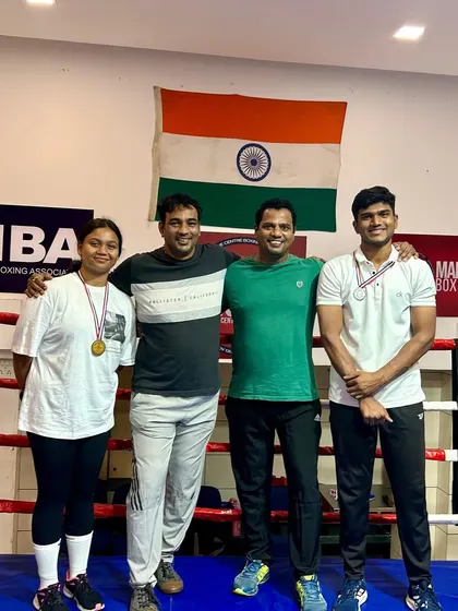 The full team celebrating the wins of Vaishnavi and Malhar at the Inter-Collegiate tournament.
