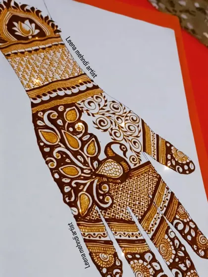 A practice design featuring a peacock and swirling paisley patterns.