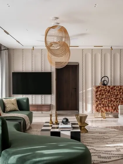A wide shot of the Evelyn living room, showcasing the expansive feel of the space. The arrangement of the furniture encourages conversation, while the large windows connect the interior to the city outside.