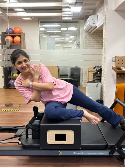 Various shots of members and instructors in action during our dynamic Reformer Pilates classes.
