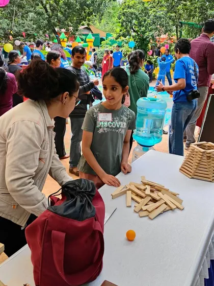 COMMUNICATION! A workshop is a constant exchange of information, both verbal and non-verbal. A child understands a gesture to place a block, or a parent and child discuss the best way to build a tower. This is how we learn to communicate effectively.