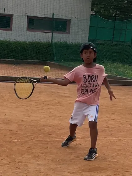 A great action shot of Kevlin Khatana hitting a forehand during a practice session.