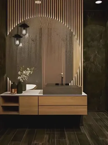 This design features a unique arched mirror set against a backdrop of vertical wood slats. The combination of dark flooring and a light wood vanity creates a high-contrast, modern look.