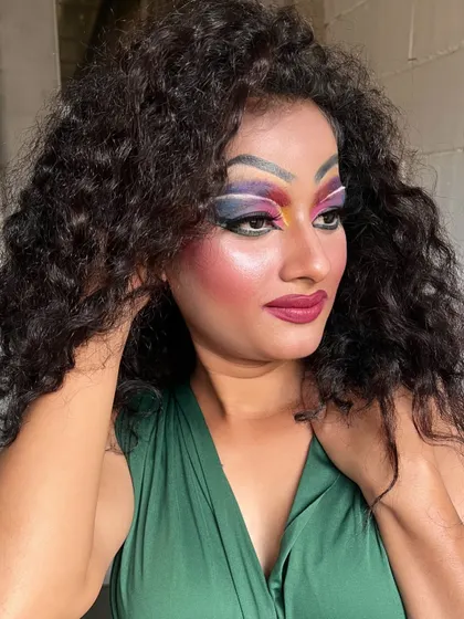 A full-glam Drag Queen makeup look created by one of our students, showcasing bold colors and dramatic contouring.