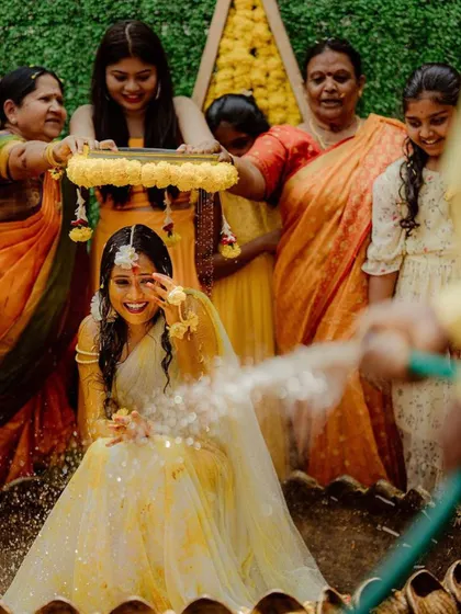 The fun continues at the Haldi function. The bride's smile shows how much fun these ceremonies are, and our decor provides the perfect festive background.
