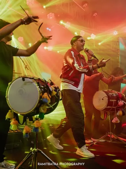 The energy of a wedding is electric, especially when the legendary Sukhbir gets the party started. This shot from a high-energy Sangeet in Goa captures the vibrant atmosphere and unforgettable performances that make big celebrations so special.