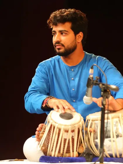 A candid shot from my performance at the Debadhara Festival. In these moments, I am listening intently to the main artist, anticipating the flow of the music to provide the perfect rhythmic support.