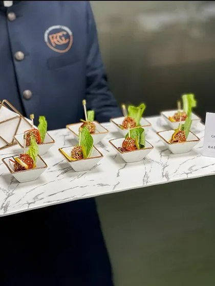 A full tray of our Gochujang Baby Potatoes, ready to be served to guests. The presentation emphasizes consistency and quality, ensuring every guest gets the same delicious experience.