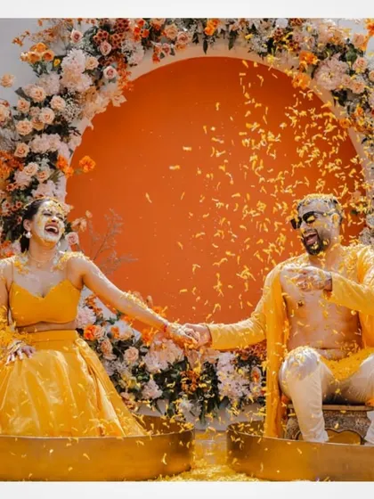 A fun shot of the couple during their Haldi ceremony in Thailand.
