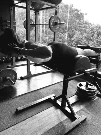 Another powerful image of a client strengthening their posterior chain on the GHD machine.