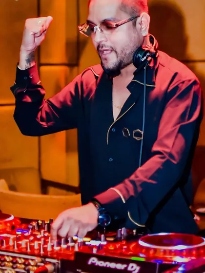 A candid moment of concentration at The Fixx Bar. The party is in full swing, and I'm lining up the next track to keep the energy peaking.