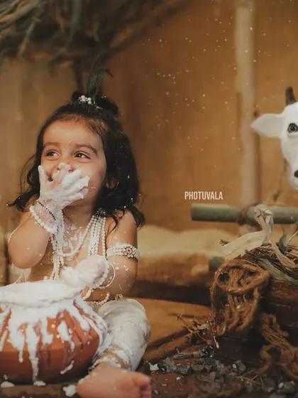 A candid shot of our little Krishna enjoying his pot of butter, with a curious cow looking on. The details in our sets help tell a complete story.