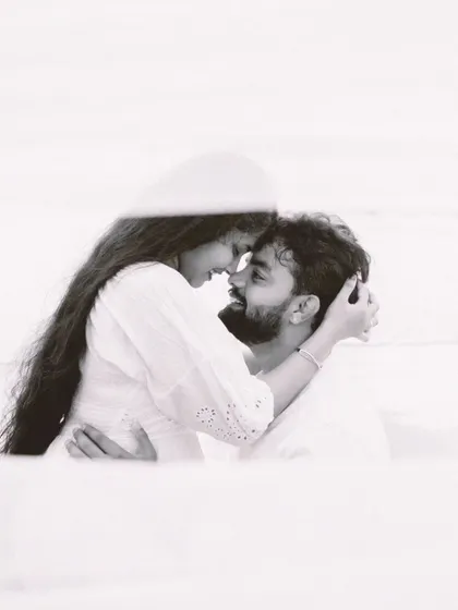 A tender, artistic black and white close-up that focuses purely on the couple's connection. This style of photography is perfect for capturing the deep, unspoken bond between two people.