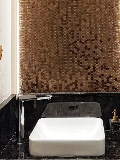 Our touch panel is seen here in a stylish powder room with black marble and mosaic tiles. This shows the versatility of our designs to fit even the most specific and luxurious spaces.