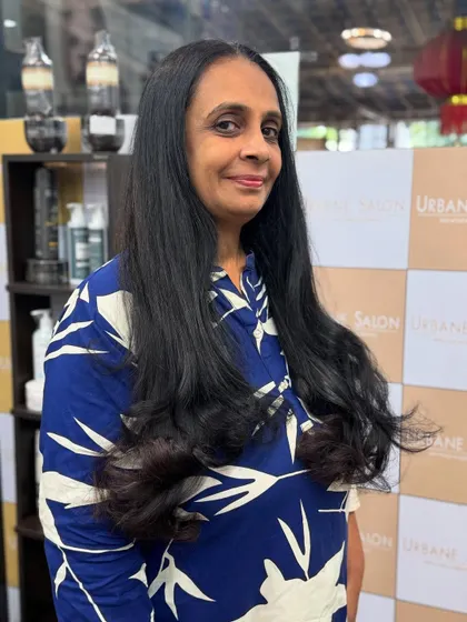 Another happy portrait of our client enjoying her fresh new haircut and style.
