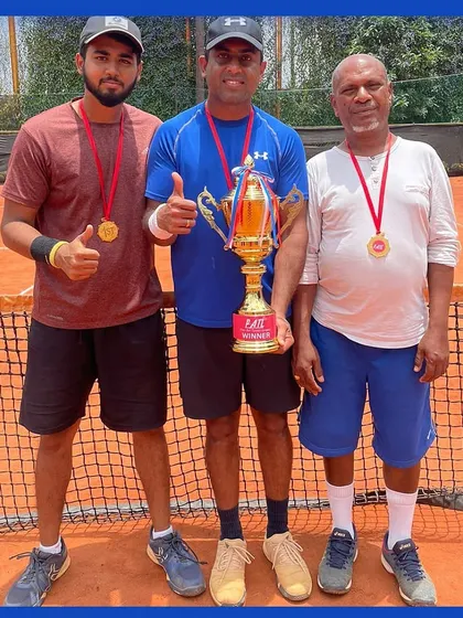 Congratulations to our players Manish, Yogesh, and Srinivas for their victory at the Patl tournament. Here they are posing with their medals and the first-place winner's trophy on the court.