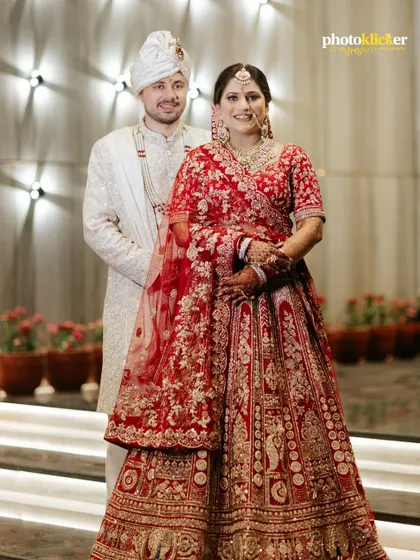 A classic portrait of the bride and groom in their stunning wedding attire. We ensure we capture these essential, timeless shots for your album. (Note: These are duplicate images).