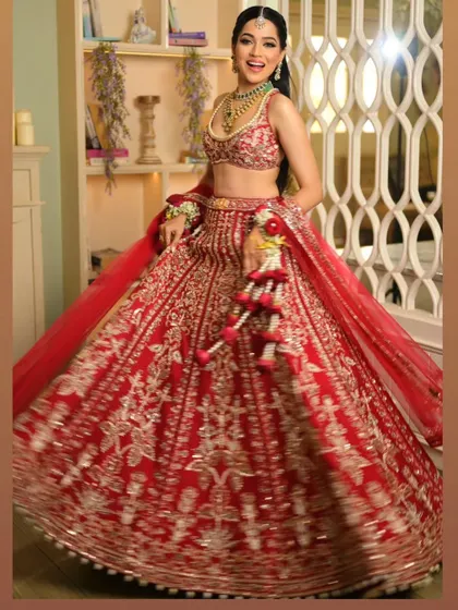 The joy on a bride's face is everything. Here, the lehenga drape is both elegant and functional, allowing her to feel completely at ease and radiant.