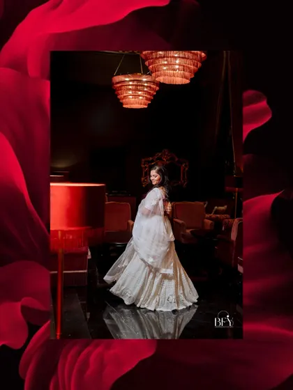 An elegant portrait of a bride-to-be, framed by a dramatic red floral border.