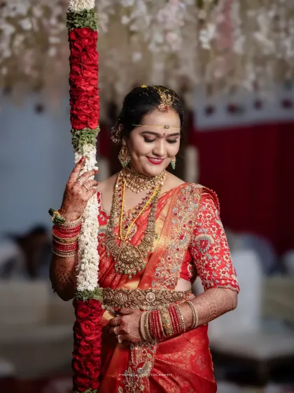 A lovely portrait of the bride, her dimpled smile and traditional attire making for a perfect shot.