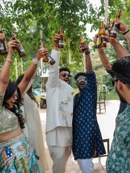 The energy of the baraat and pre-wedding festivities is infectious. We capture the couple and their friends dancing, playing games, and celebrating with pure, uninhibited joy.