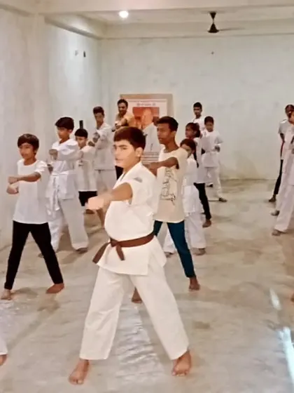The mix of belts in this photo shows that junior and senior students train together, learning from each other.