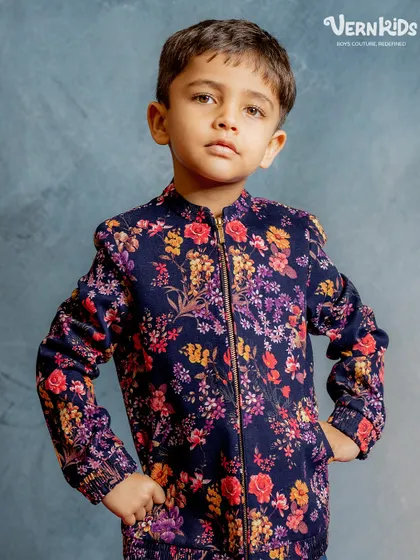 A close-up of our navy floral bomber. The rich colors and detailed floral pattern make this a standout piece, crafted for comfort and ultimate coolness.