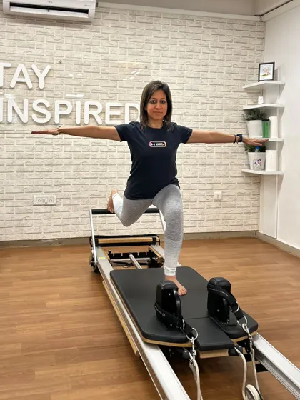 Various shots of members and instructors in action during our dynamic Reformer Pilates classes.
