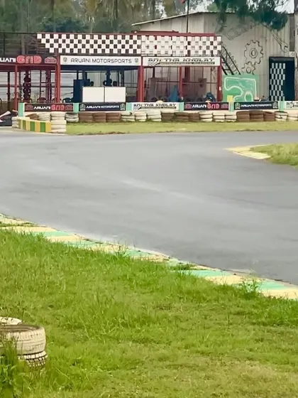 A view of the track from the sidelines, with our pit building in the background. This is where the action begins.