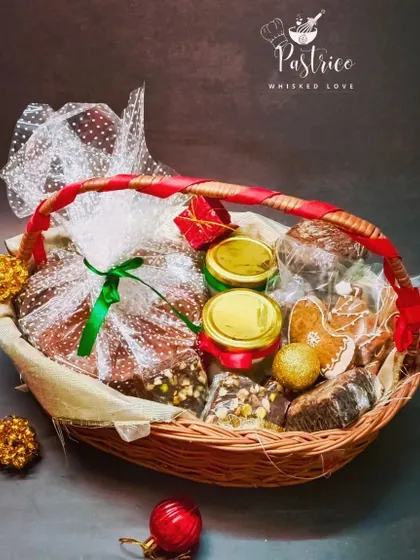 Gifting is my specialty, and this custom Christmas hamper is a great example. It's filled with a variety of my homemade goodies, including a traditional plum cake, chocolate walnut brownies, and gingerbread cookies.