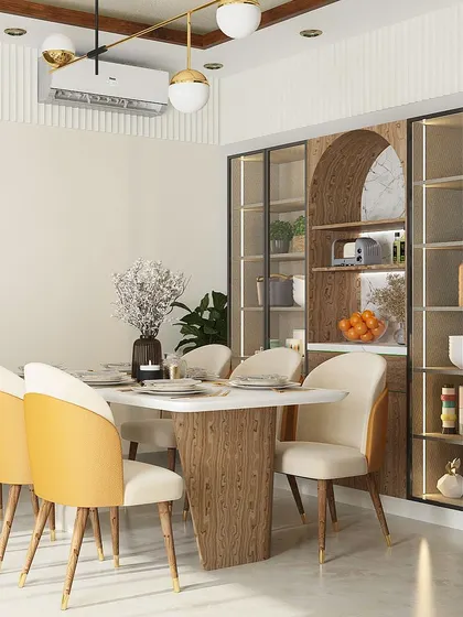 We designed this elegant 6-seater dining set for a project in DLF Phase 1. The chairs, with their two-tone upholstery, add a pop of color against the full-height crockery unit with arched details and integrated lighting.