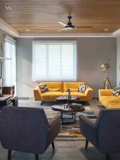For this Gurgaon apartment makeover, I reimagined the space with an open floor plan and a neutral grey palette accented by pops of yellow and blue. The result is a stylish, contemporary home perfectly suited for modern urban living.