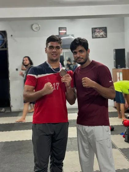 Posing with my student Vaibhav after he won the bronze medal at the REC Open Talent Hunt tournament. A proud moment for our academy.