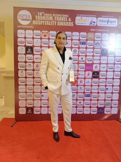 Posing with my award at the 19th Annual International Tourism, Travel & Hospitality Awards. Being named 'Caterer of the Year' is a significant honor.