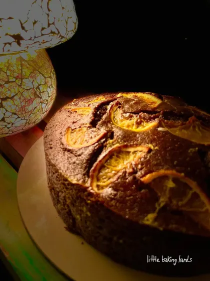 A side profile of the rich chocolate and orange cake. You can see the lovely texture and height of this simple, unfrosted bake.