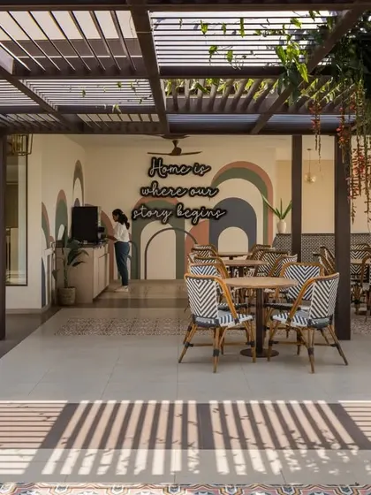 The office is planned around a series of open-air courtyards and shaded verandahs, creating a campus-like feel.