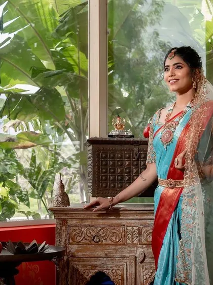 Another shot from the styled shoot. The natural light from the window highlights the flawless finish of the makeup.