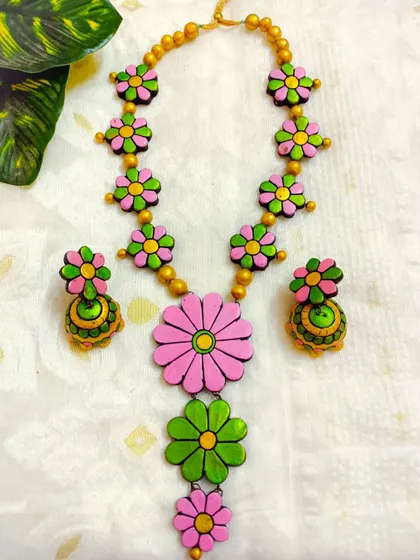 These are additional images of the floral necklace sets in various colors, showcasing the wide range of options available for bulk purchase.