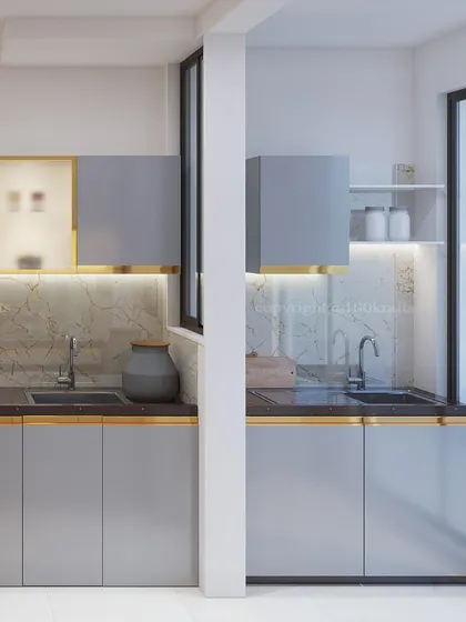 A sleek and sophisticated kitchen design. The layout is split by a central pillar, creating distinct zones for prep and washing, while maintaining a cohesive look with the grey and gold color scheme.