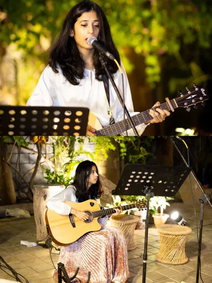 Live music adds a soulful touch to any event. Here, a talented musician performs at an outdoor party, creating a relaxed and enjoyable atmosphere for guests.