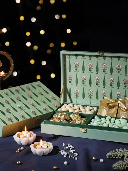 A truly indulgent gift, this box is filled with our butter cookies, rabdi cashews, pista white chocolate almonds, and fruit & nut dark chocolate clusters.