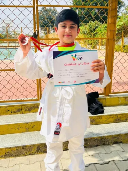 A proud young champion. Adhyan showing off his silver medal from the Viva Inter-School Judo Competition.