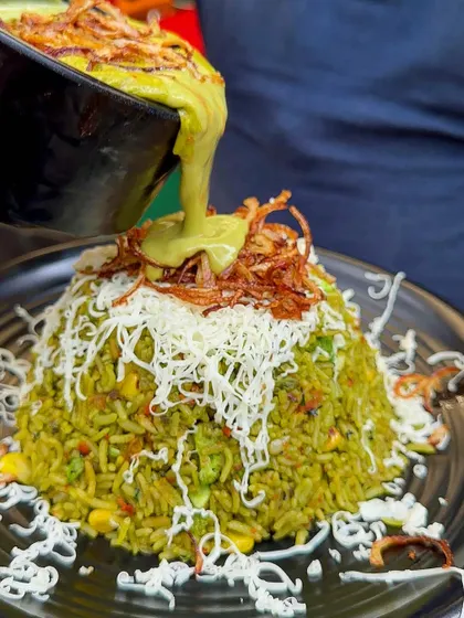 My Thai Green Curry with rice is a flavorful and aromatic dish, topped with fried onions and cheese for a unique twist.